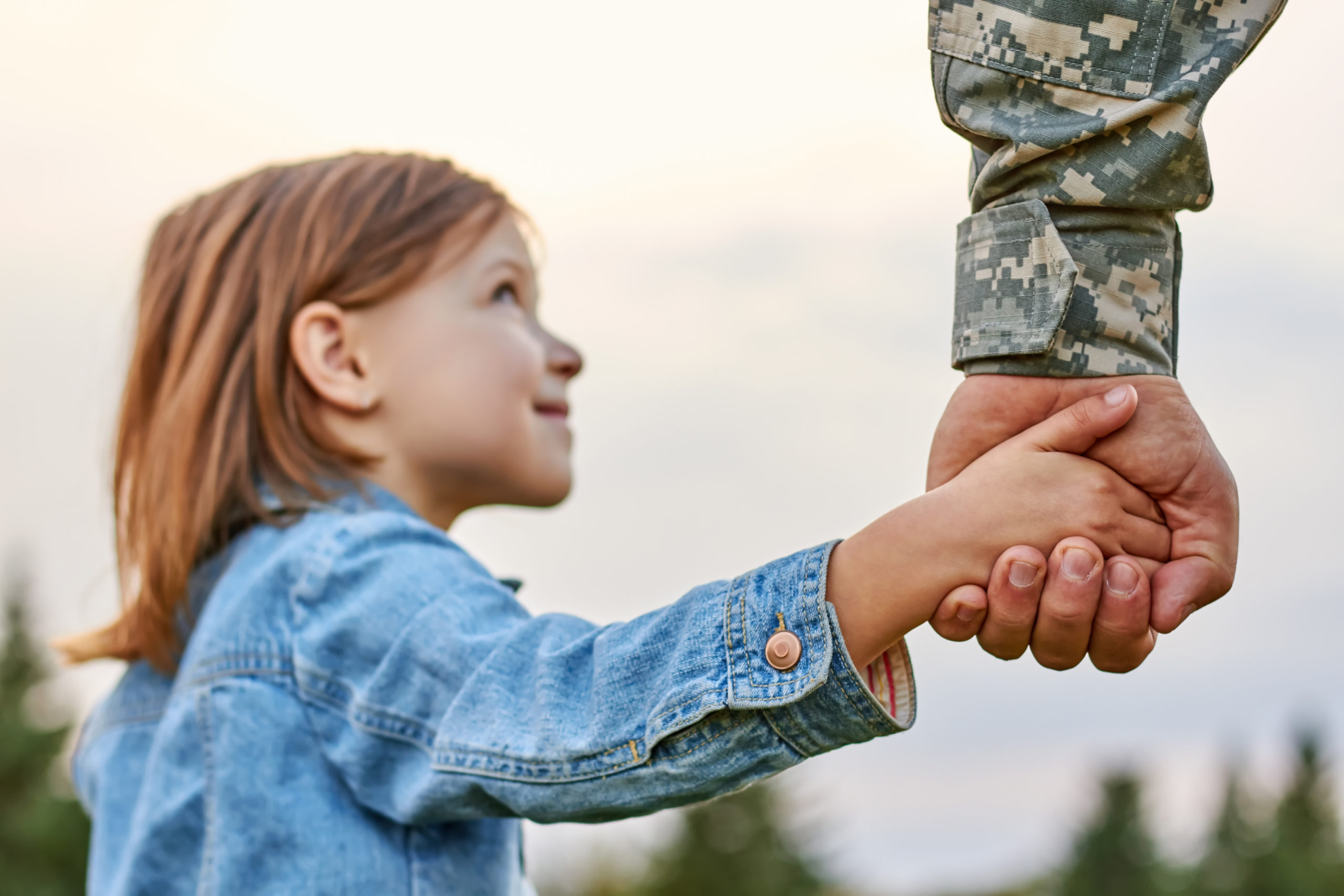 PTSD Veterans Image - soldier holding daughter's hand
